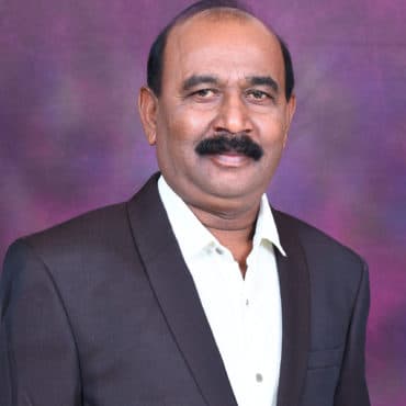 Portrait of SRI. A. H. KUBERAPPA, Director at DHUSBN
