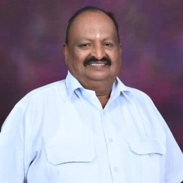 Portrait of SRI. S. K. PRABHUPRASAD, Director at DHUSBN